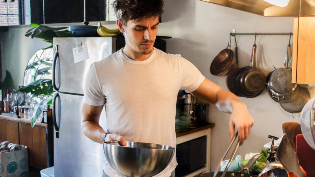 man cooking in kitchen
